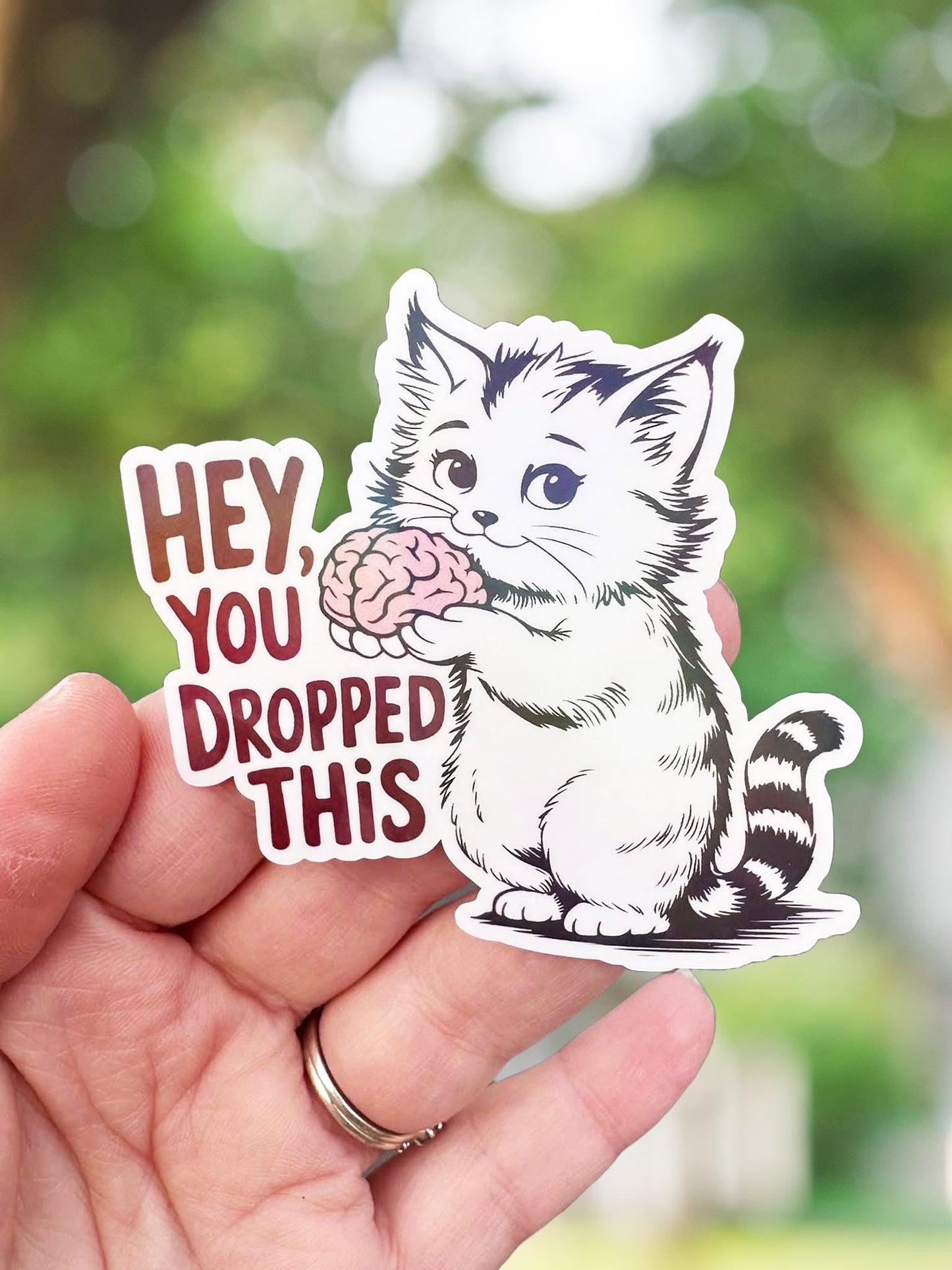 You dropped this funny cat holding brain sticker