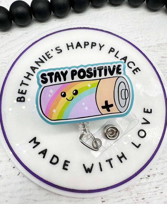 Stay positive battery badge reel