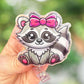 Raccoon with pink bow badge reel