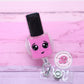 Pink nail polish badge reel