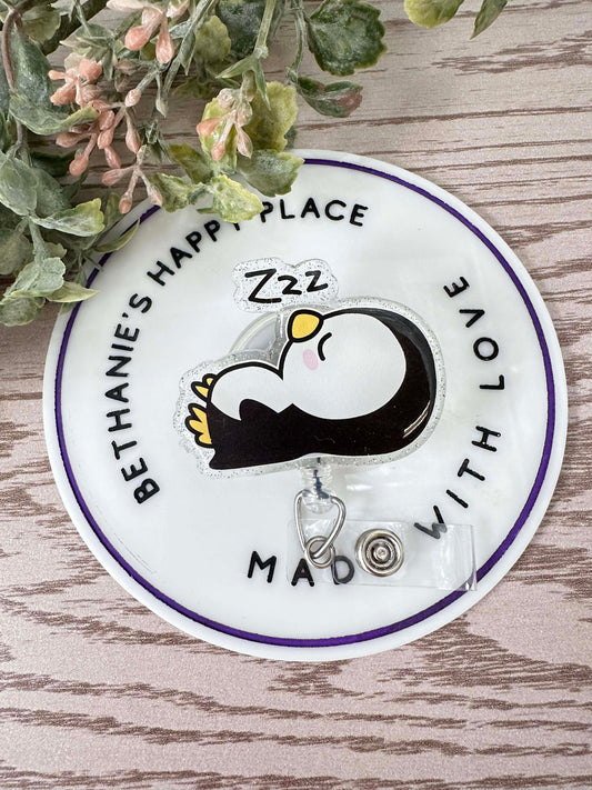 Sleepy penguin badge reel