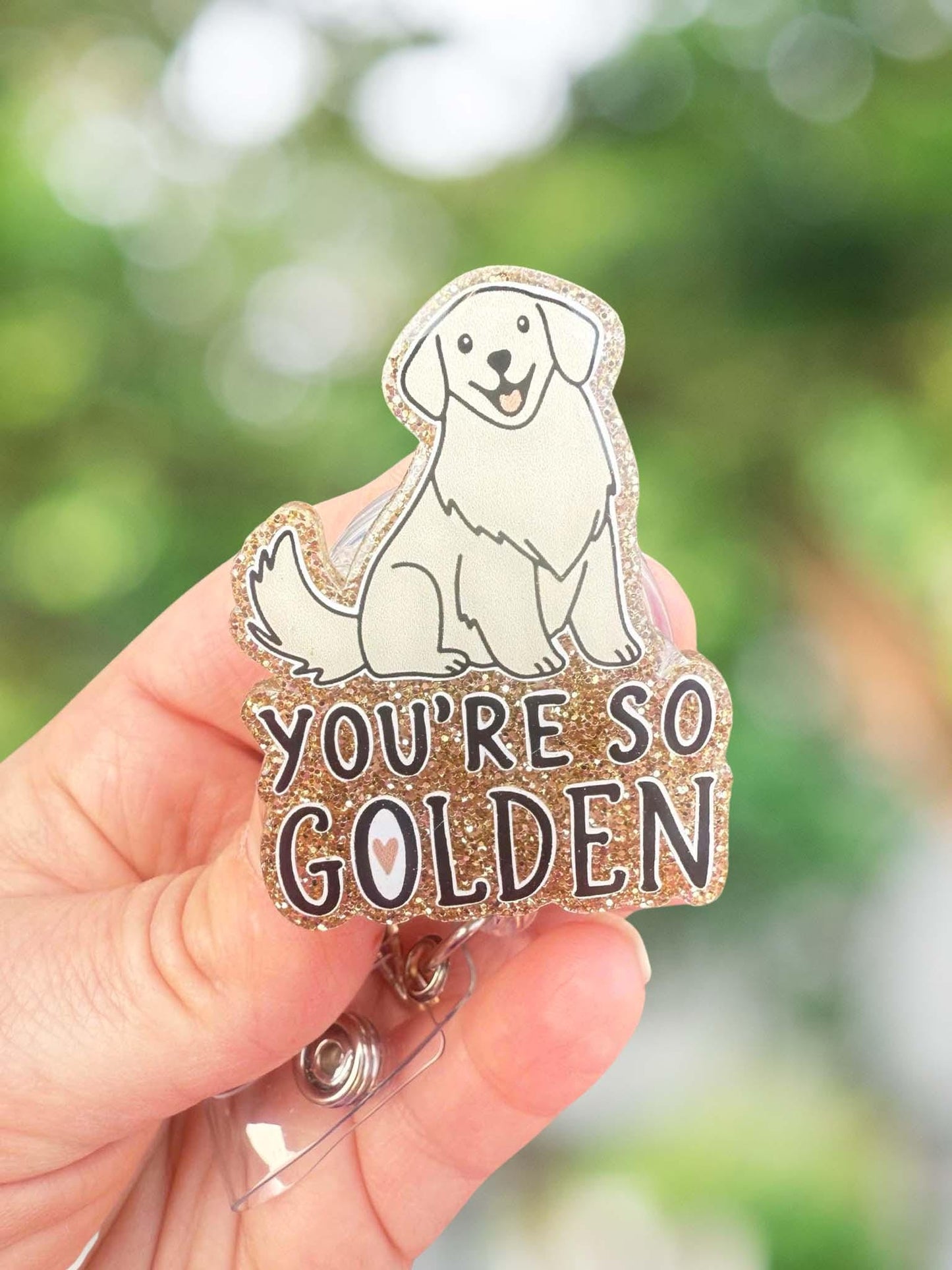 So golden retractable badge reel