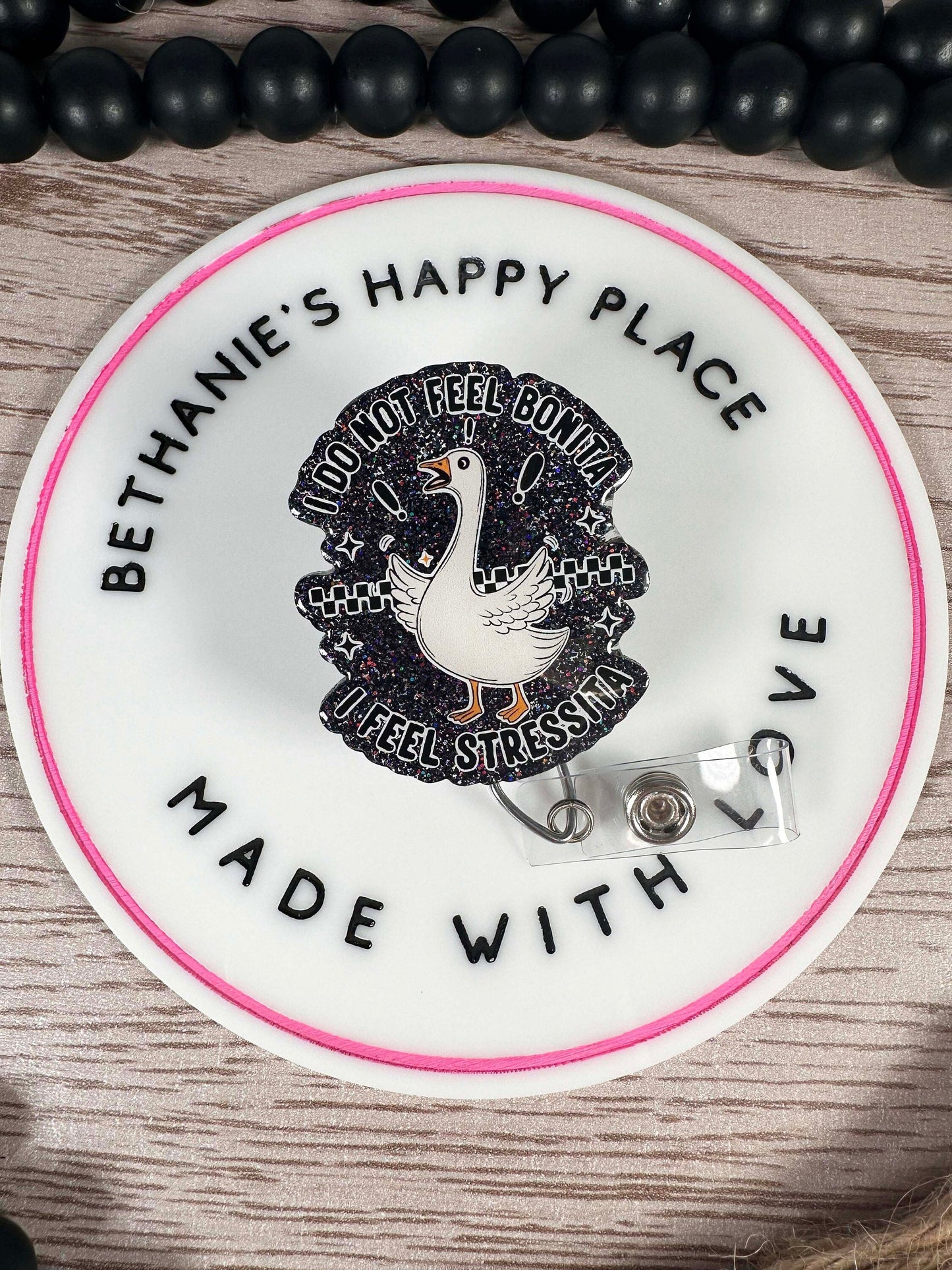Stressed goose retractable badge reel