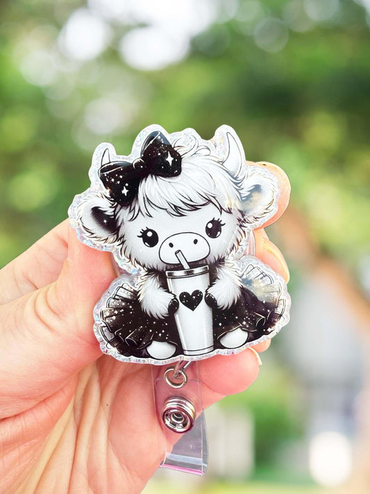 Black and white cow retractable badge reel