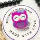 Purple owl badge reel