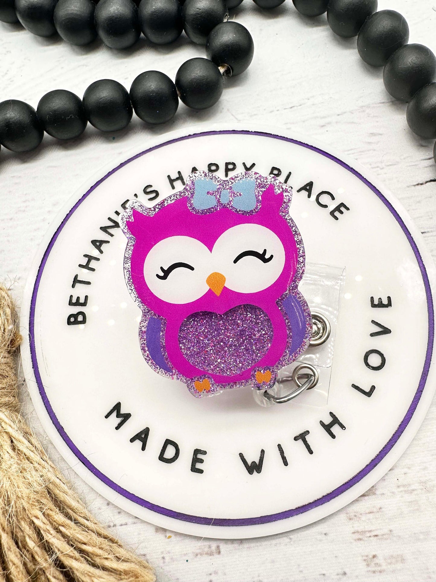 Purple owl badge reel