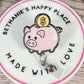Piggy bank retractable badge reel