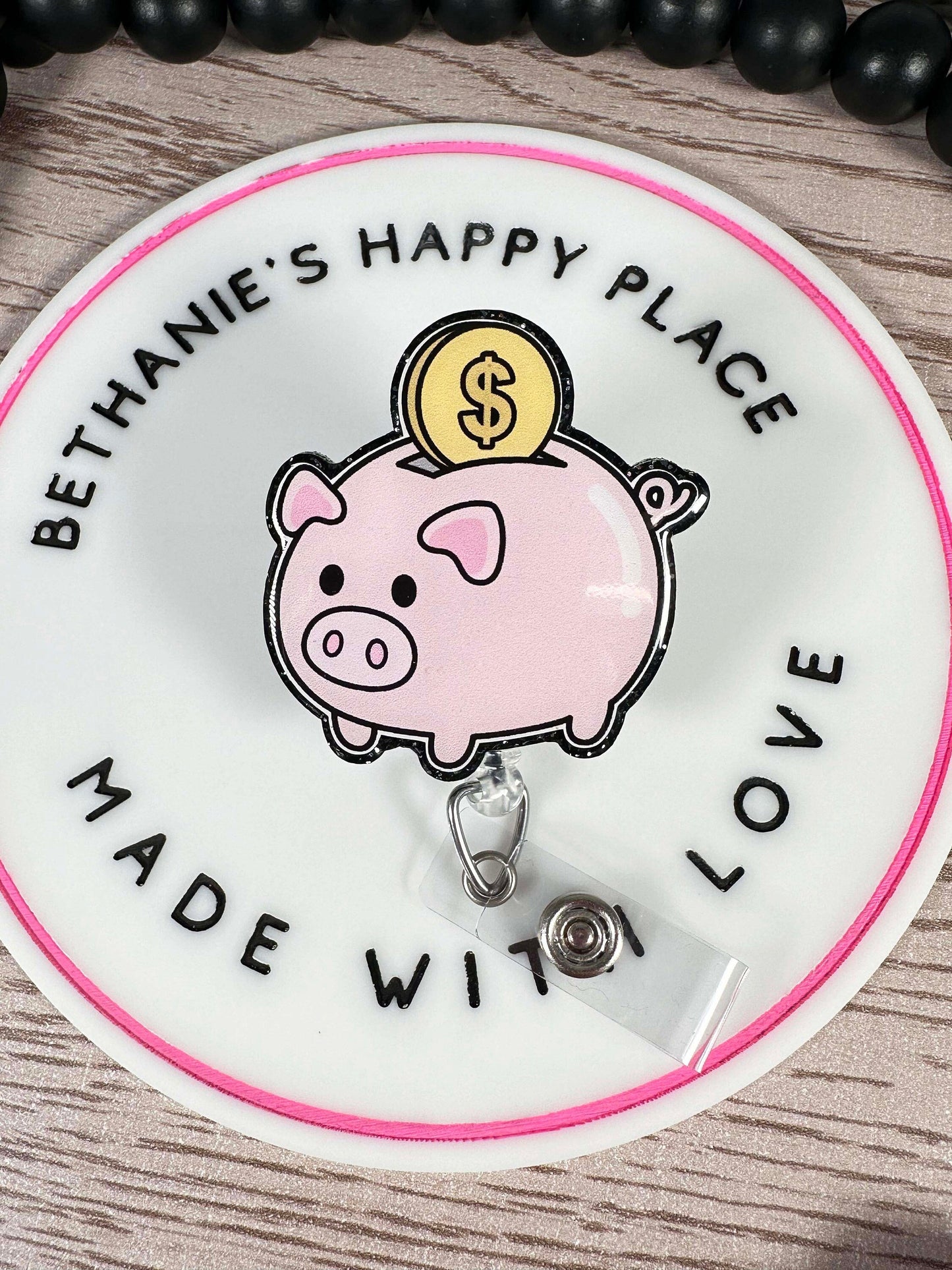 Piggy bank retractable badge reel