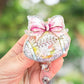Disco football with bow retractable badge reel