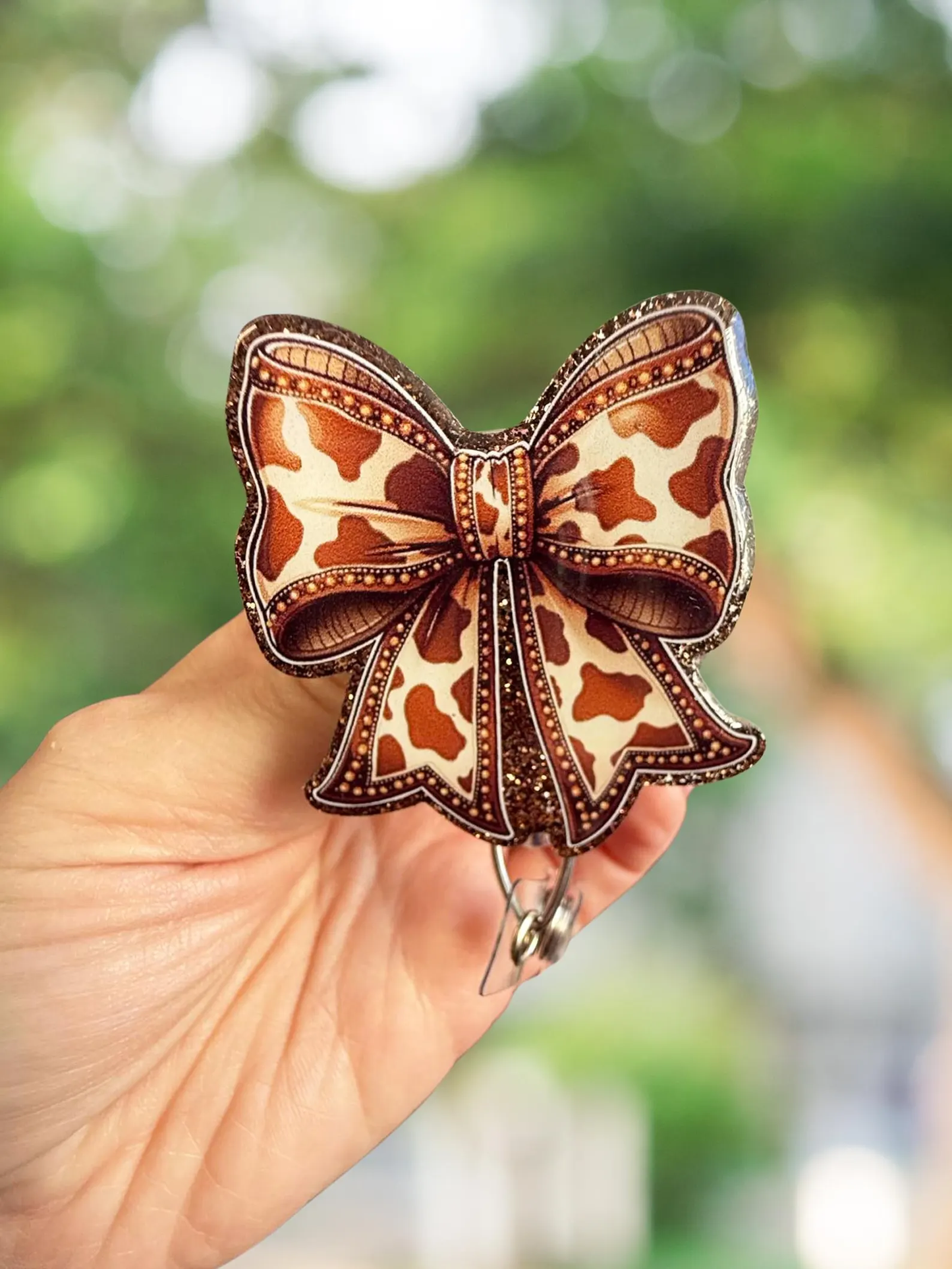 Brown cow print retractable badge reel