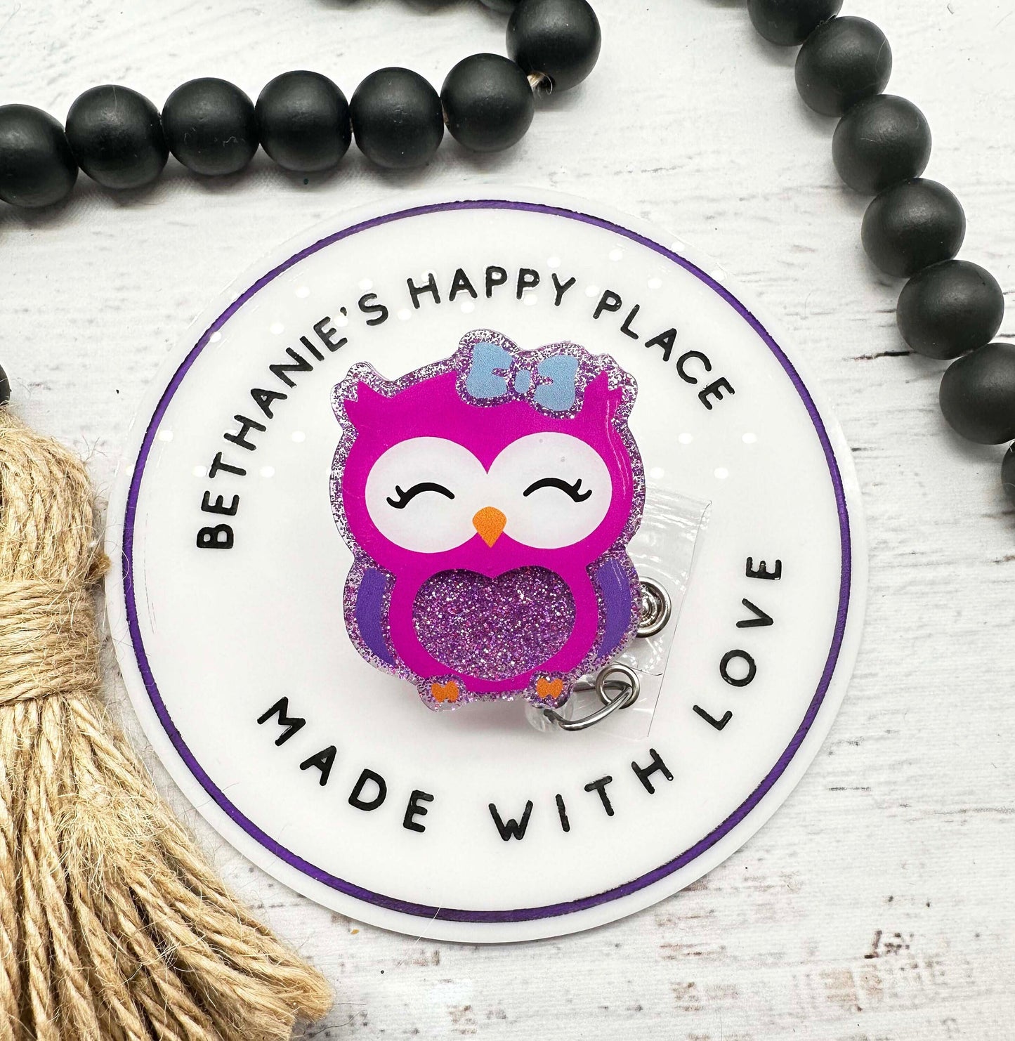 Purple owl badge reel