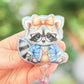 Cute raccoon in glasses badge reel