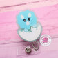 Baby dinosaur badge reel