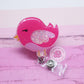 Pink bird badge reel