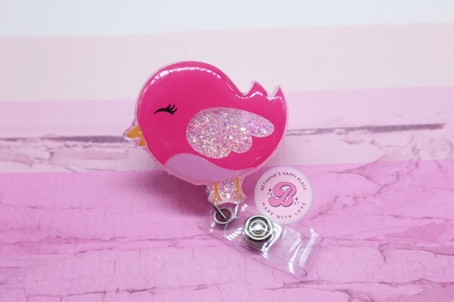 Pink bird badge reel