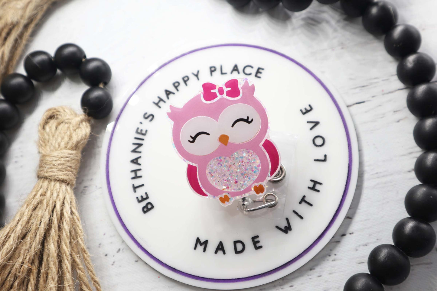 Pink owl badge reel