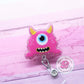 Pink monster badge reel