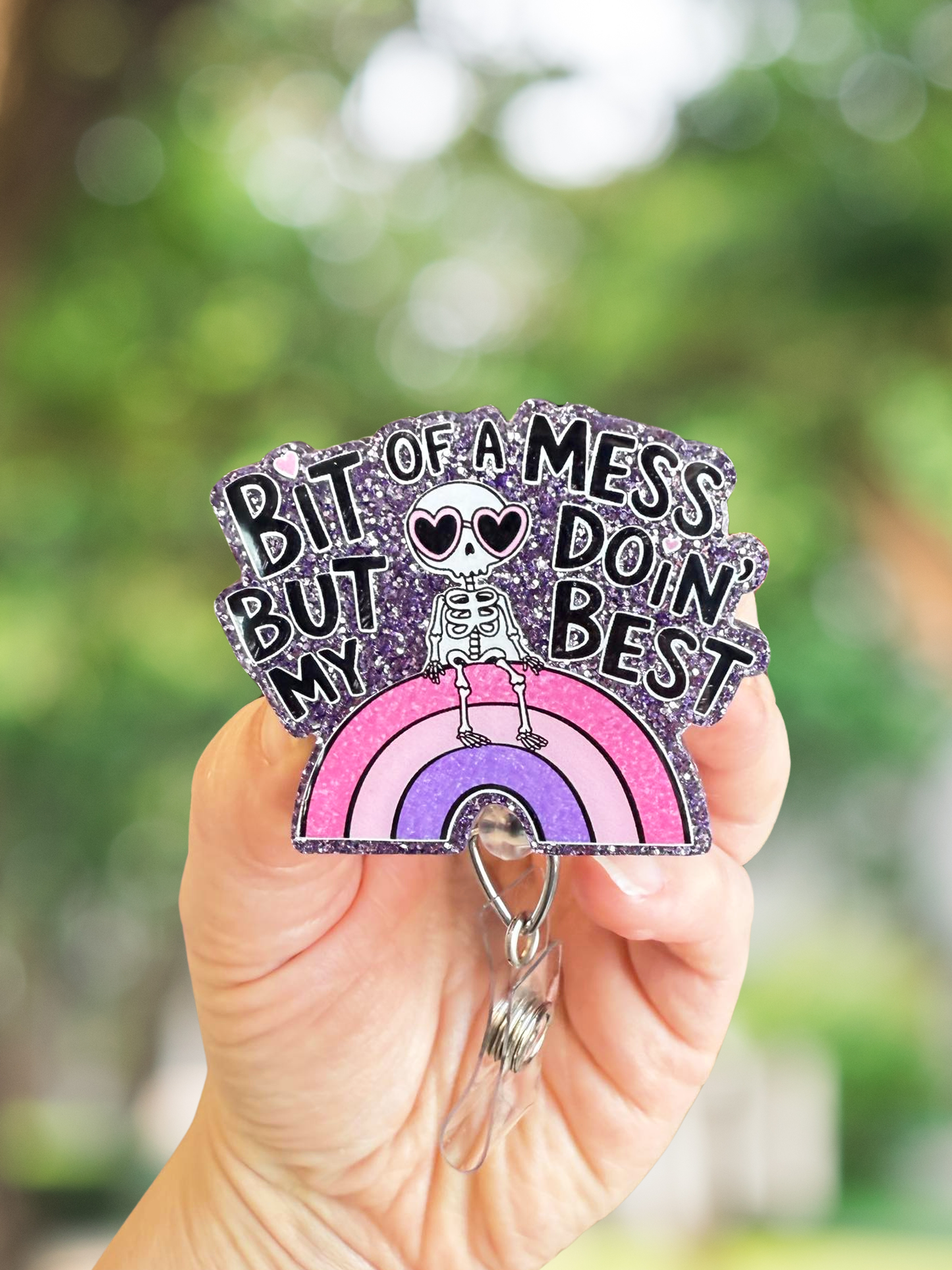 Bit of a mess but doin' my best skeleton rainbow retractable badge reel