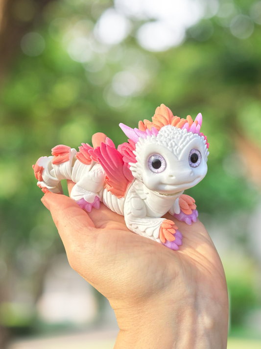 Pink and white articulated 3D printed dragon
