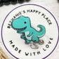 Teal dinosaur badge reel