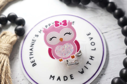 Pink owl badge reel
