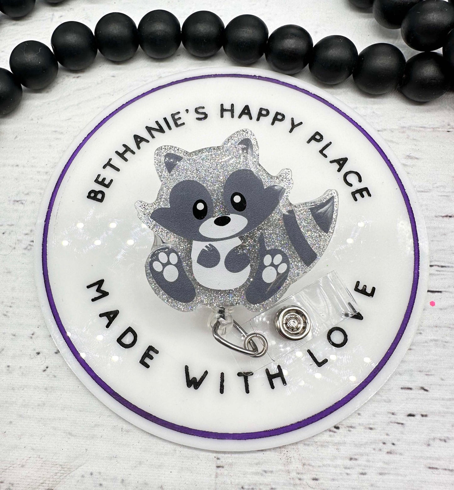 Sitting raccoon badge reel