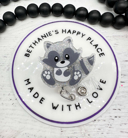 Sitting raccoon badge reel