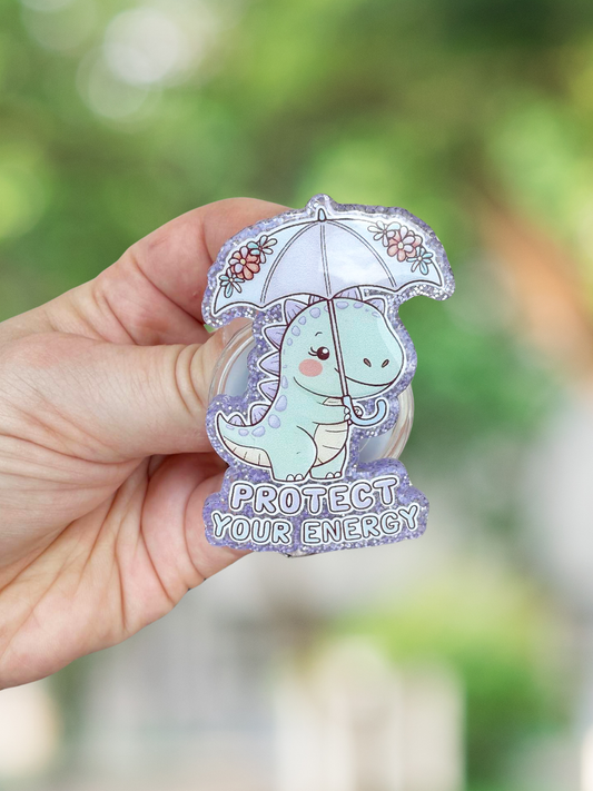 Protect your energy dinosaur badge reel
