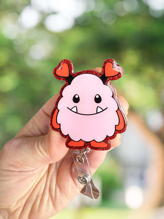 Pink and red monster retractable badge reel
