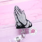 Praying hands badge reel