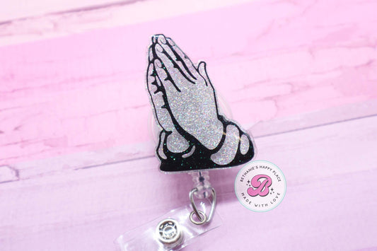 Praying hands badge reel