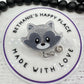 Raccoon head badge reel