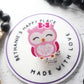 Pink owl badge reel