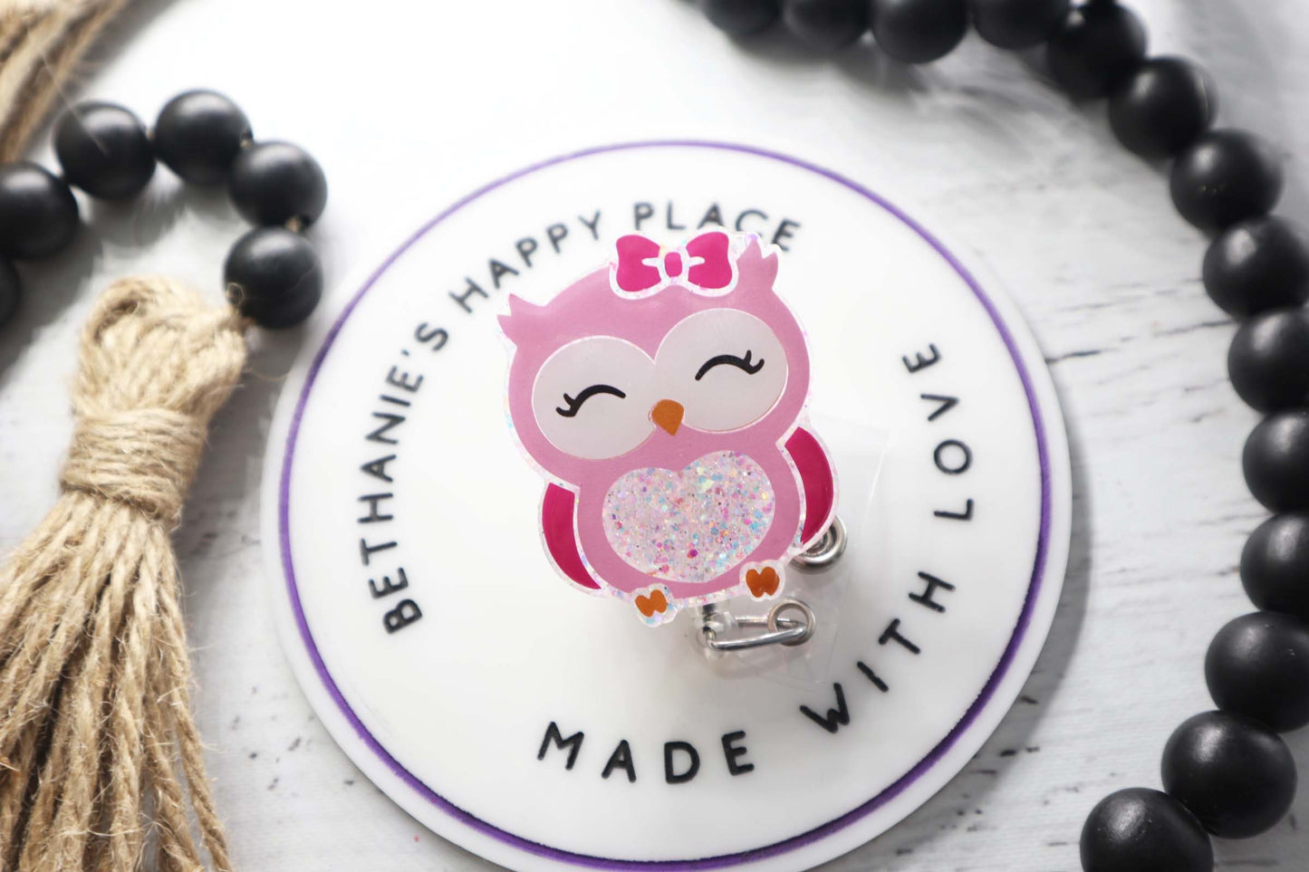Pink owl badge reel