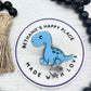 Blue dinosaur bronotsaurus badge reel