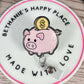Piggy bank retractable badge reel
