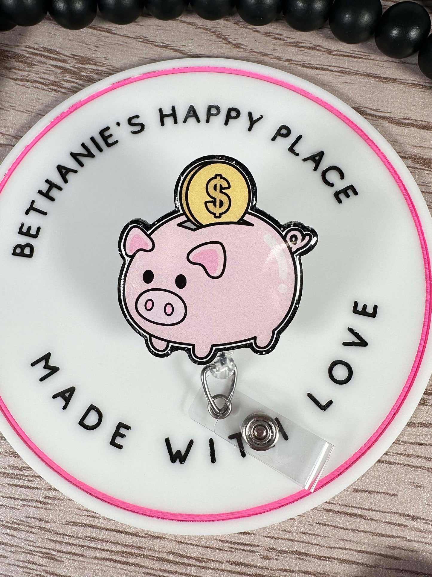 Piggy bank retractable badge reel