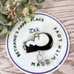 Sleepy penguin badge reel
