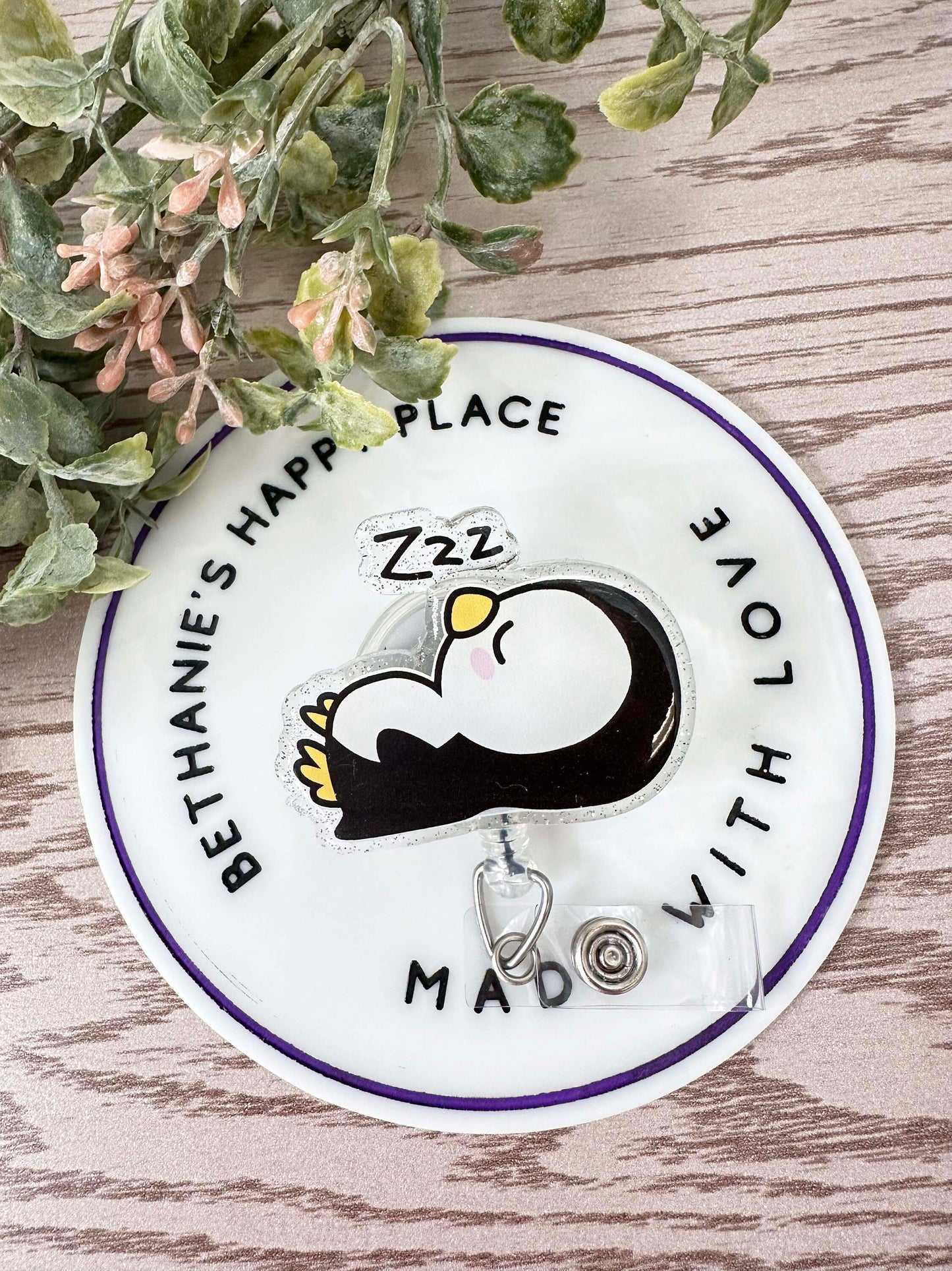 Sleepy penguin badge reel