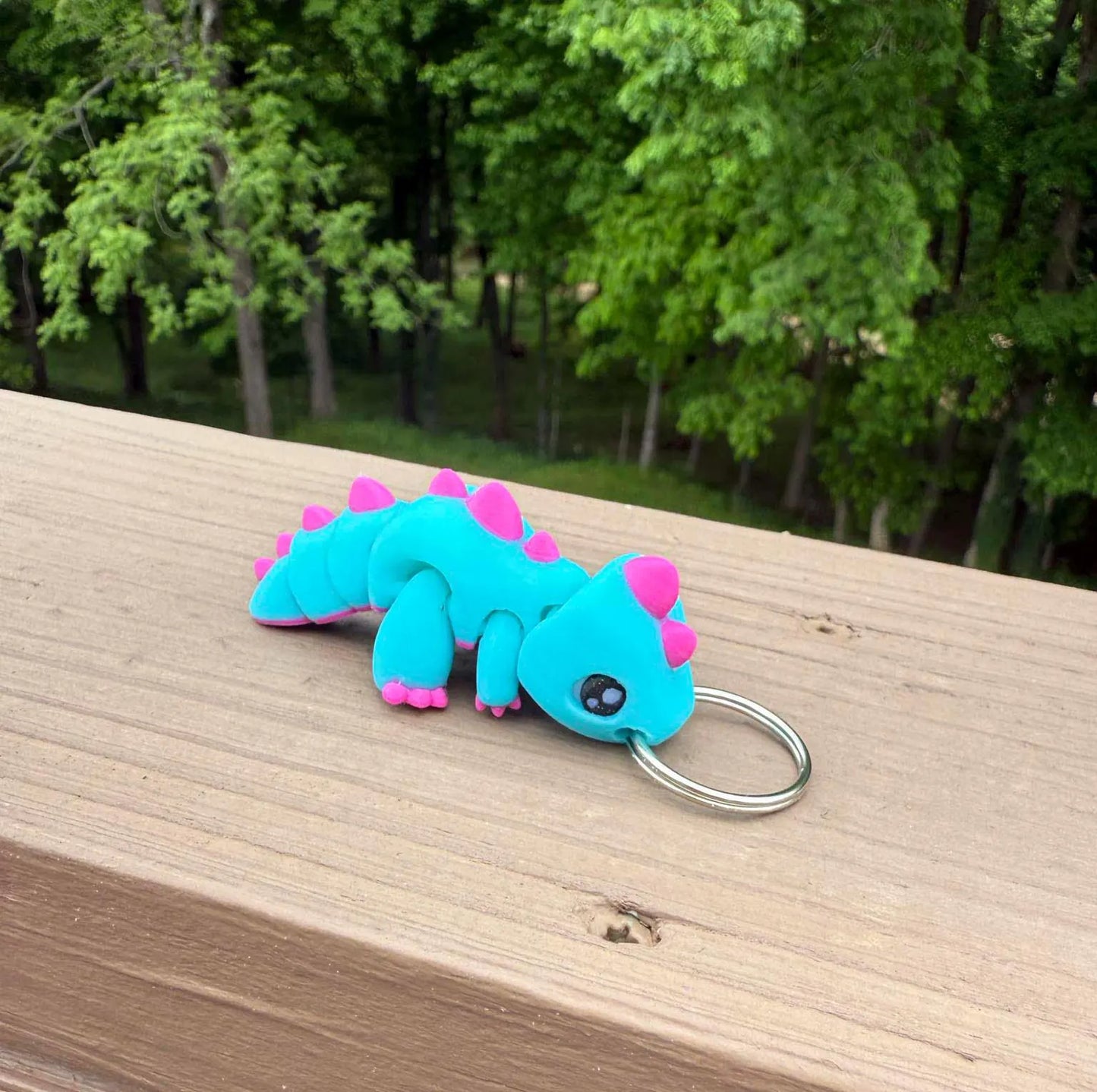 Blue and purple dinosaur keychain
