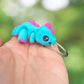 Blue and purple dinosaur keychain