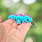 Blue and purple dinosaur keychain