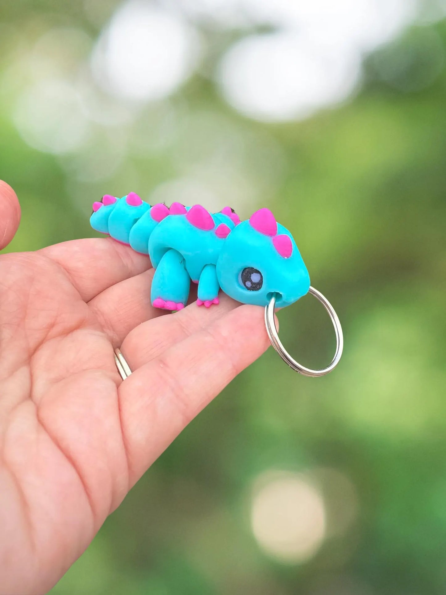 Blue and purple dinosaur keychain