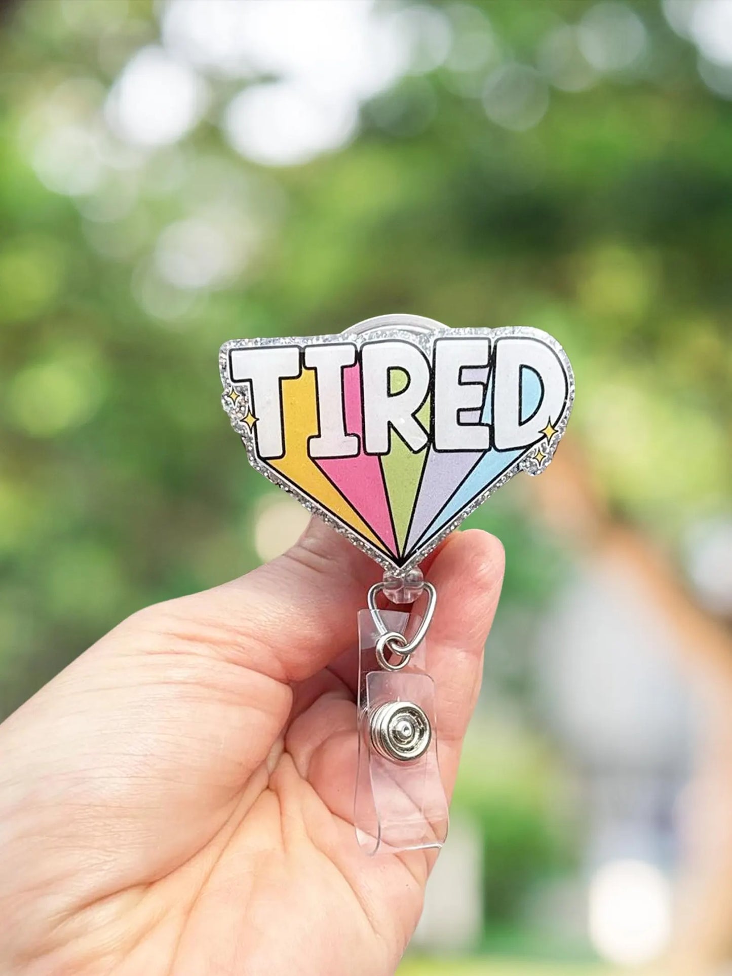Tired retractable badge reel