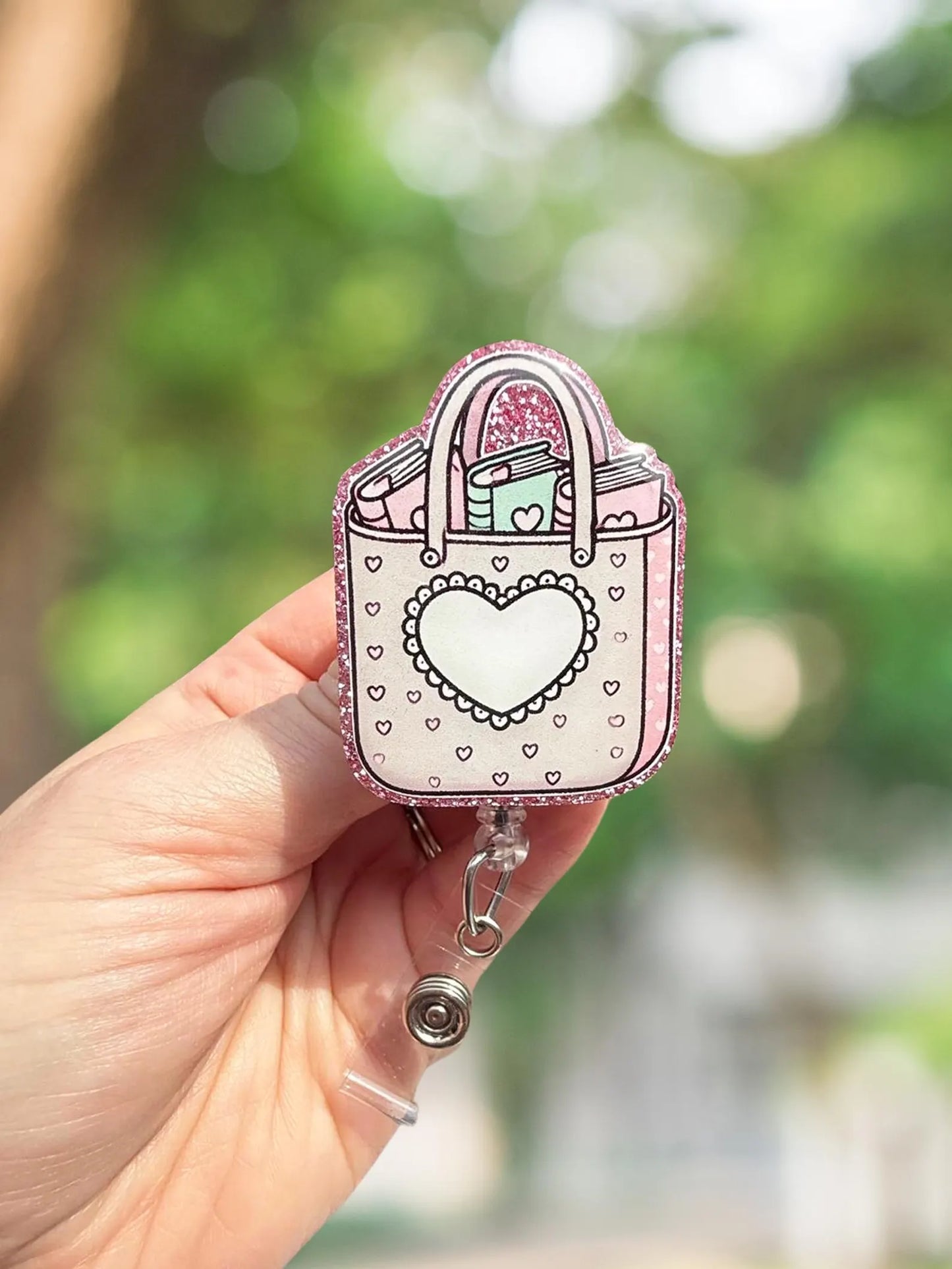 Book bag retractable badge reel