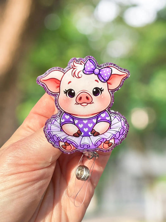 Chubby pig in purple retractable badge reel