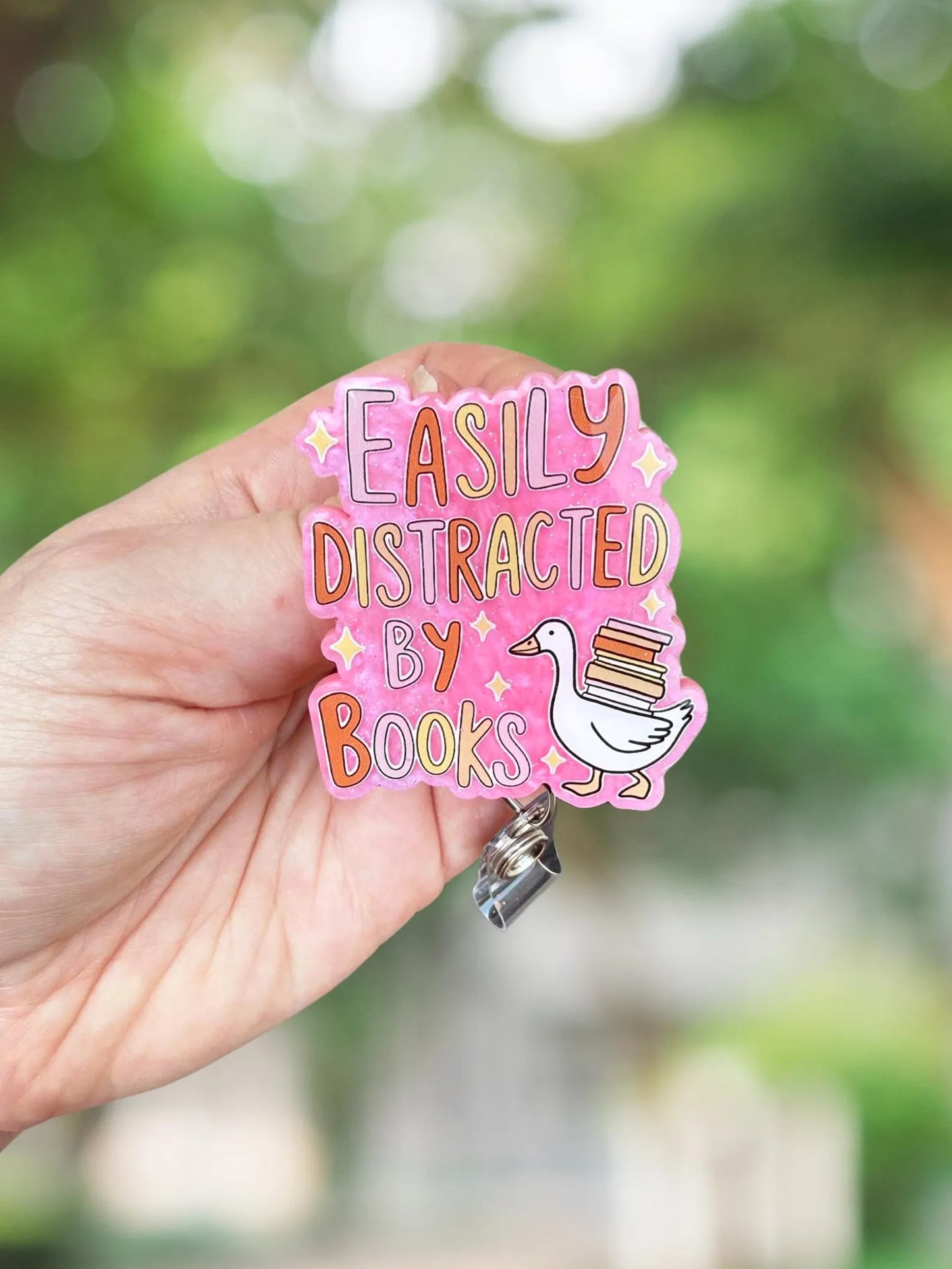 Easily distracted by books goose badge reel