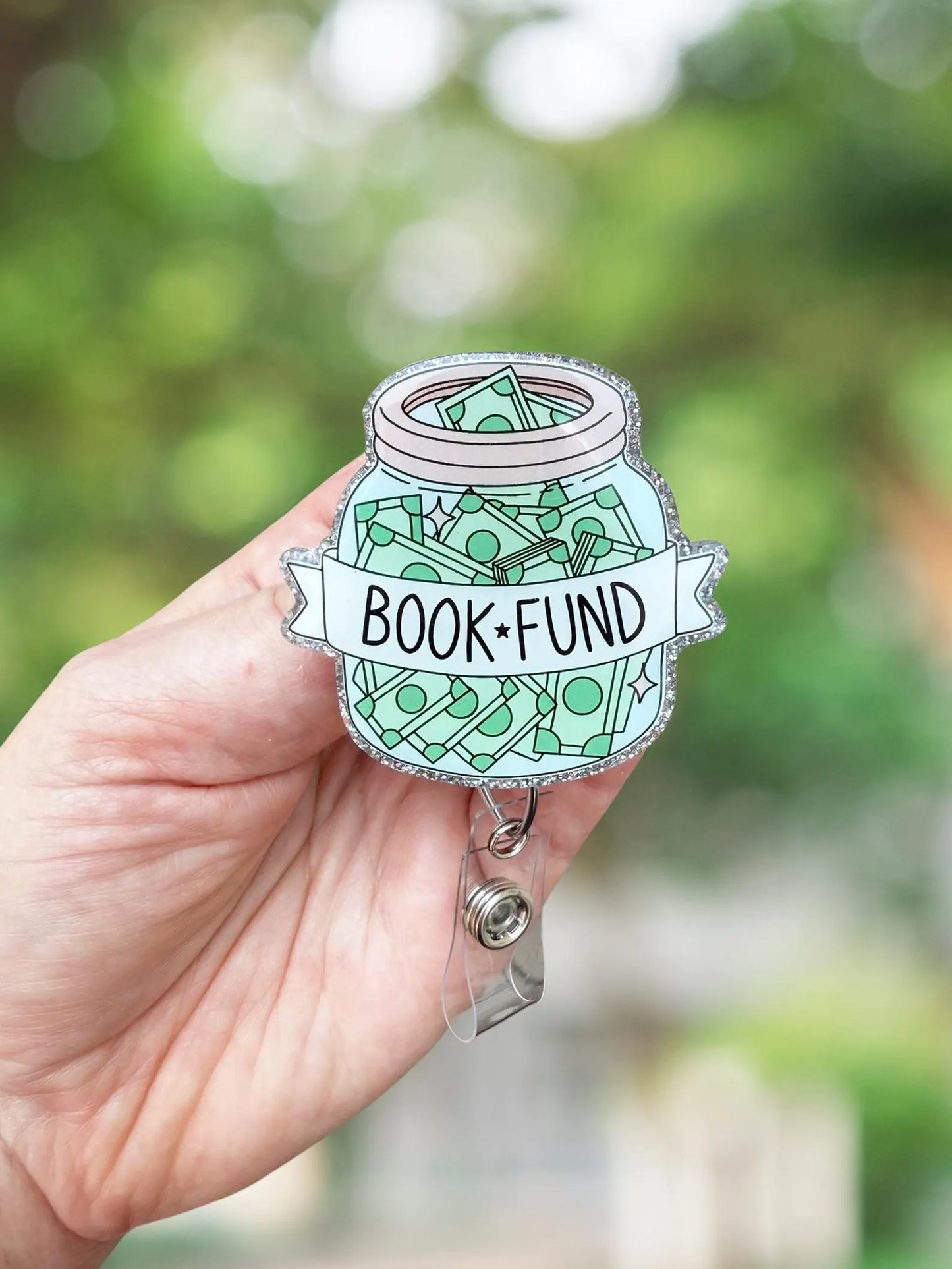 Book fund money jar retractable badge reel