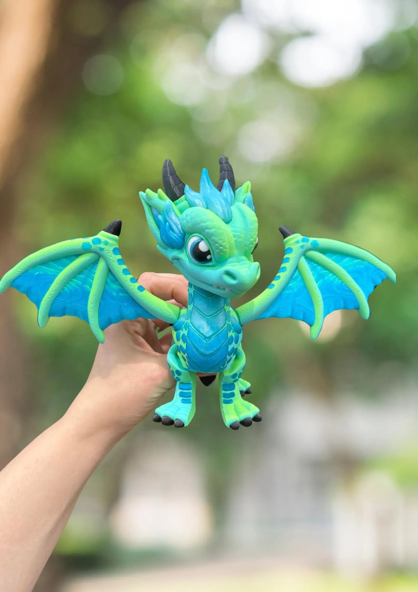 Large blue and green 3D printed articulated western dragon