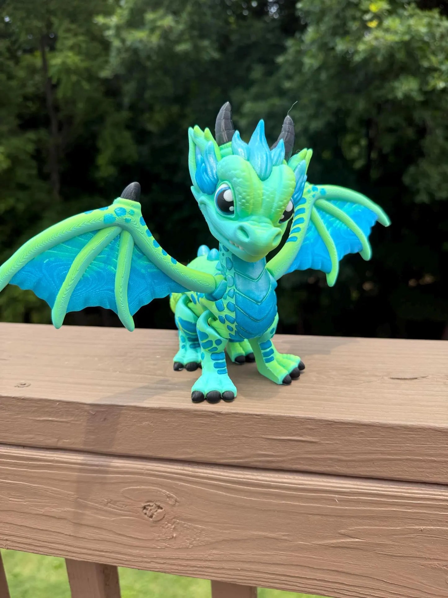 Large blue and green 3D printed articulated western dragon